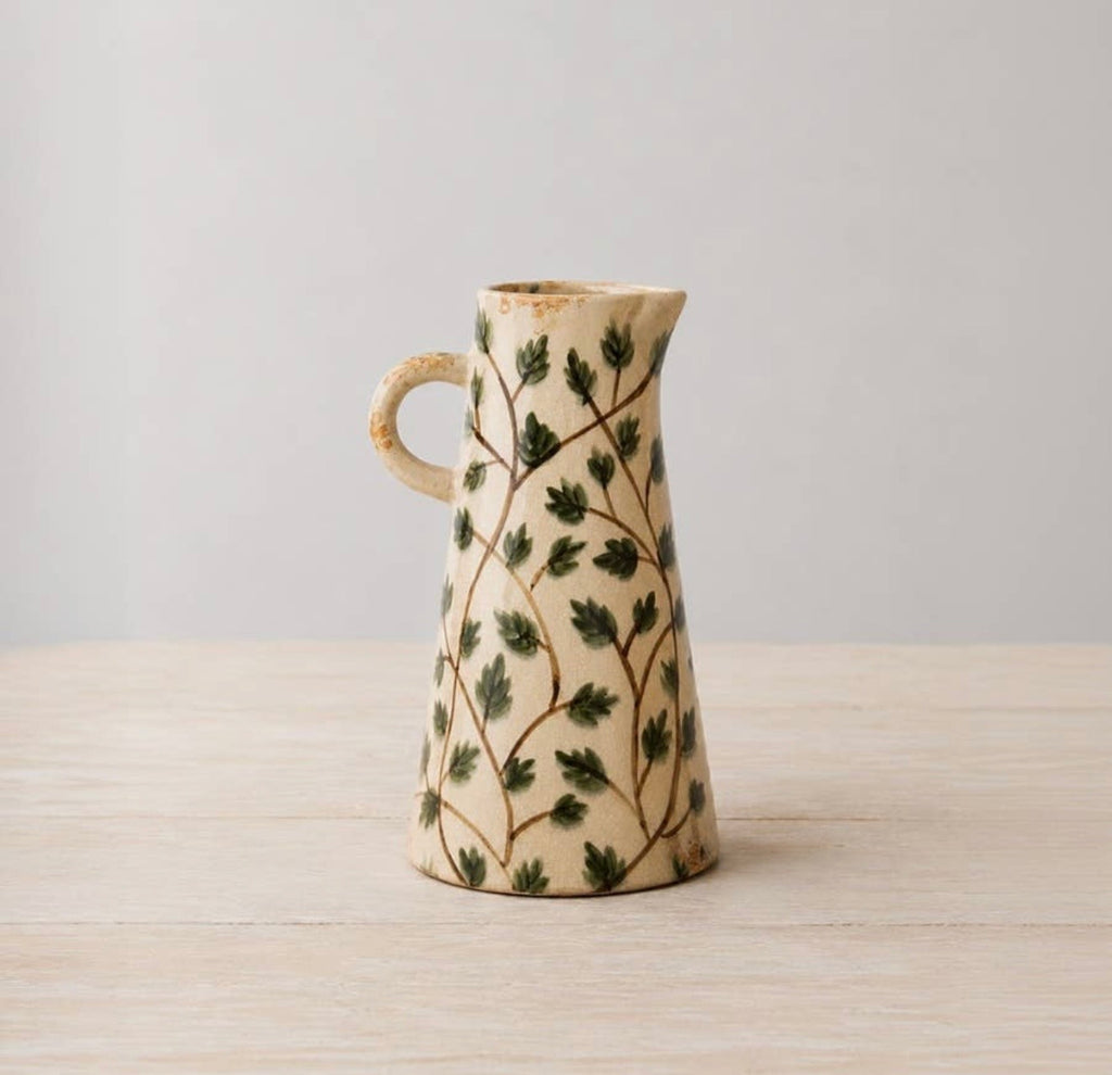 Botanical ceramic vase jug with leaf design for fresh flowers or decorative styling.