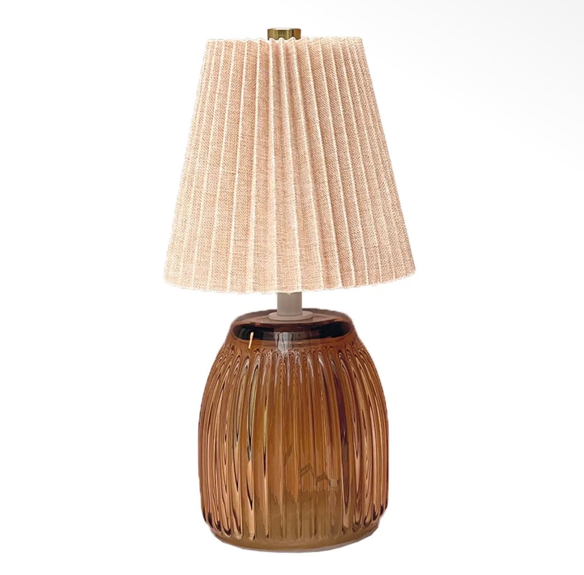 Amber ribbed battery operated LED table lamp with a neutral pleated fabric shade.