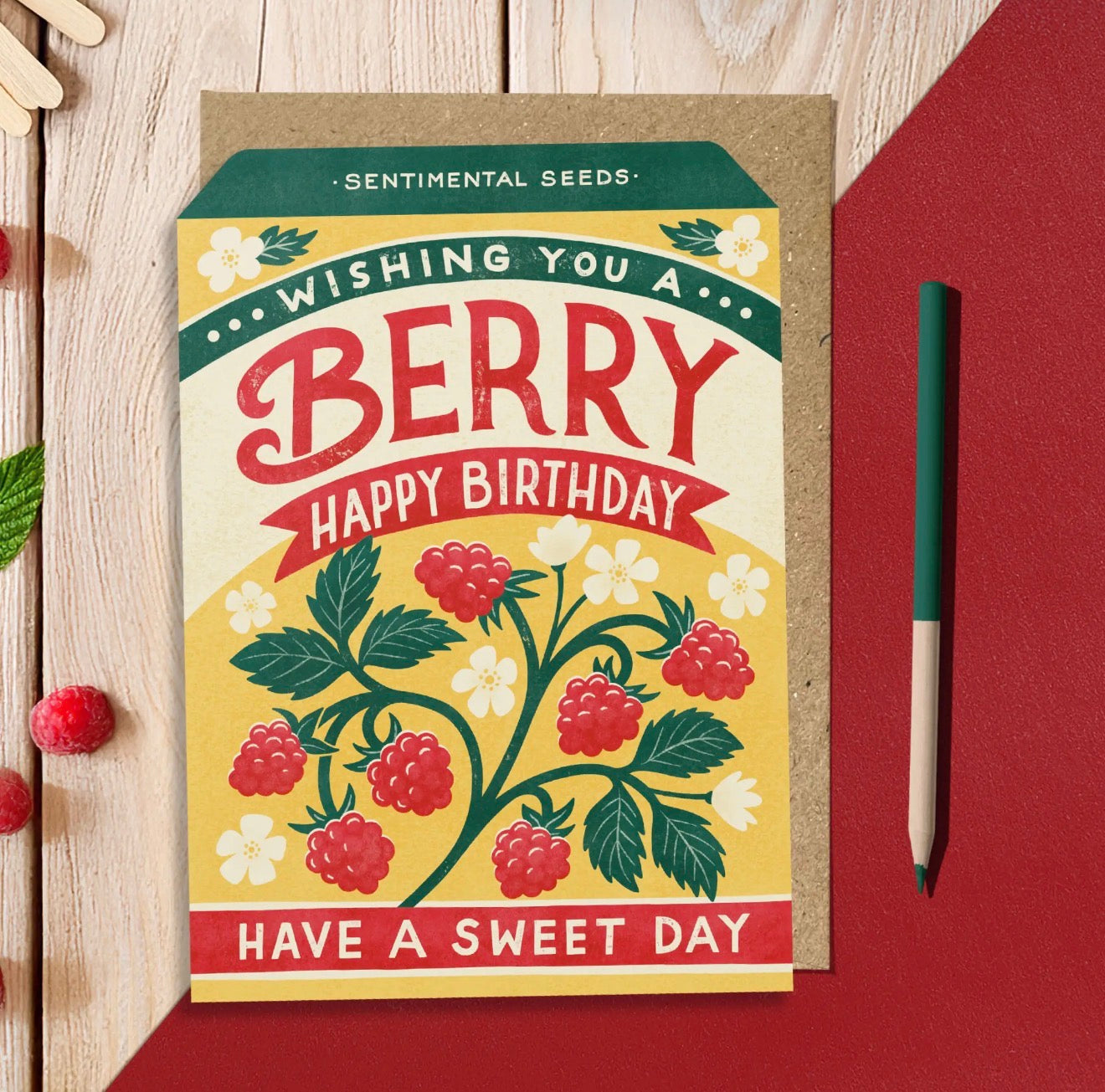 Yellow and red Berry Happy Birthday greeting card with illustrated raspberries, green leaves and white flowers.