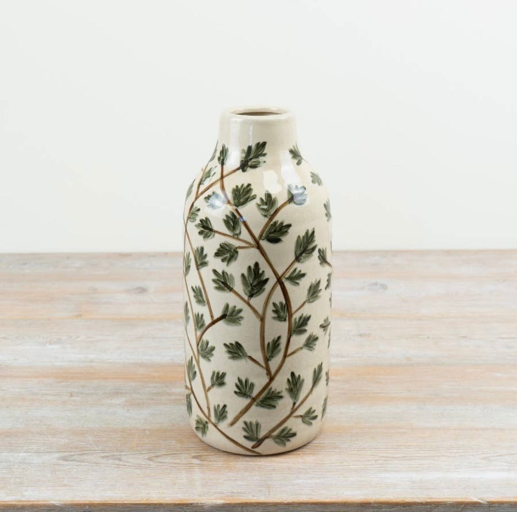 Botanical ceramic vase with a leaf design for fresh or dried flowers.