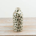 Botanical ceramic vase with a leaf design for fresh or dried flowers.