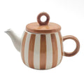 Brown and cream striped ceramic teapot with a rounded body, circular handle and matching brown lid.