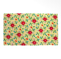 Natural rectangular doormat with a colourful floral pattern of red, orange and lilac flowers with green leaves.
