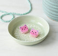 Set of two small pink glitter cat hair claw clips with cute faces and clear claw teeth.