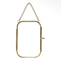 Rounded rectangular brass hanging photo frame with a delicate chain and side clasp.
