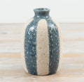 Rustic striped ceramic bud vase with a textured natural stone-effect finish in neutral beige and blue tones.