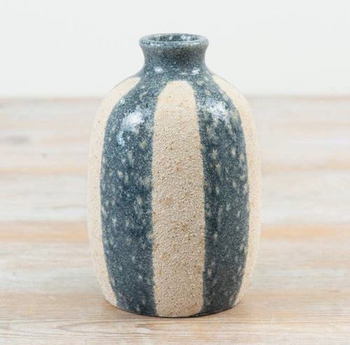 Rustic striped ceramic bud vase with a textured natural stone-effect finish in neutral beige and blue tones.