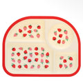 Cream four-section toddler plate decorated with red and pink strawberries and finished with a bright red border.