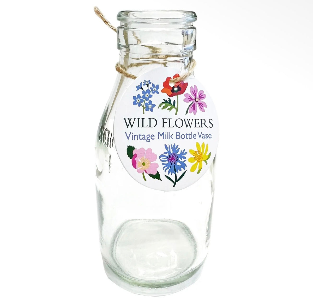 Clear vintage-style glass milk bottle vase with a colourful wildflower illustrated tag tied around the neck.