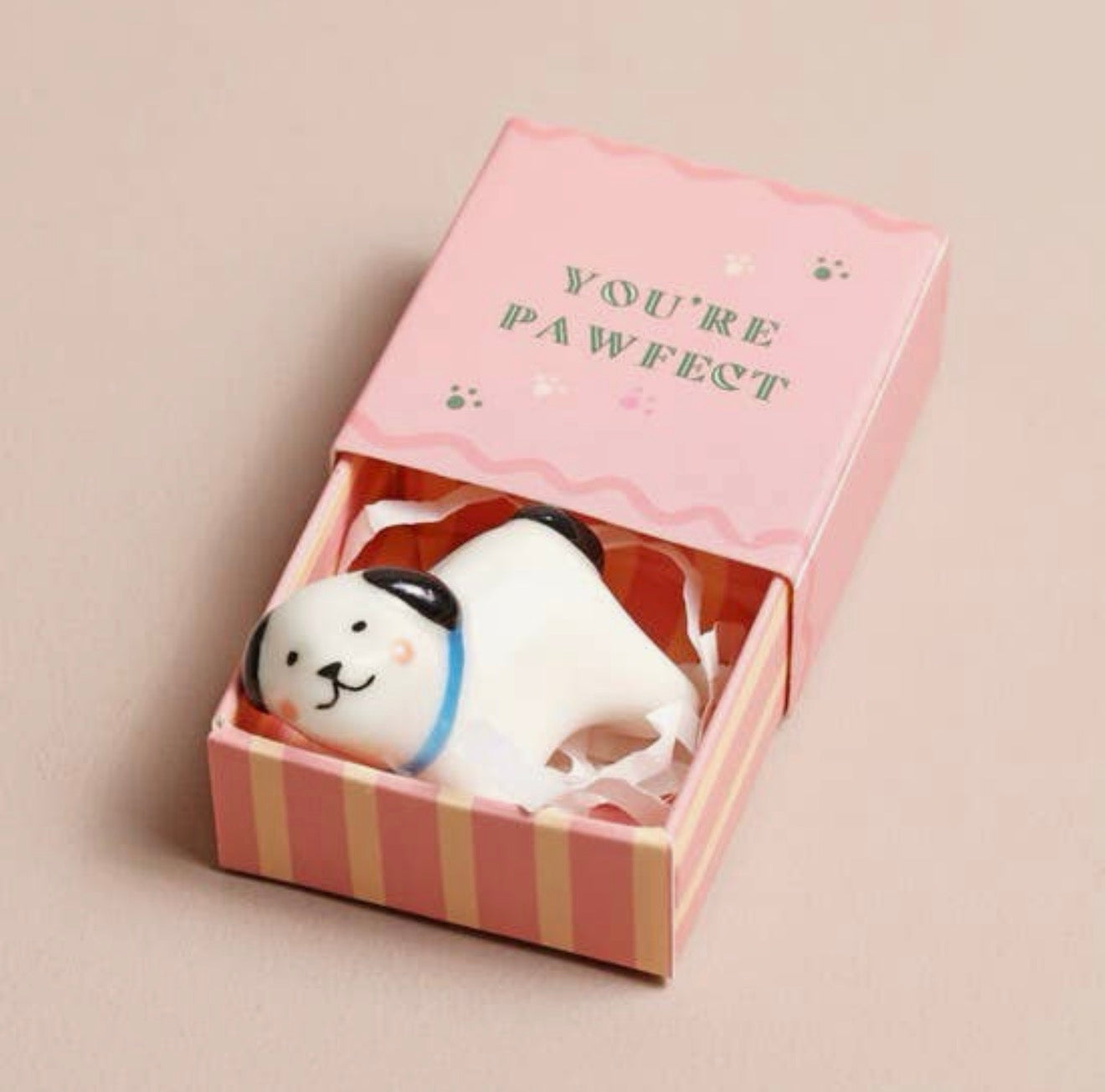 Ceramic dog keepsake token presented in a pink matchbox with the message “You’re Pawfect”.